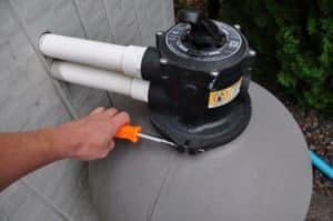 changing swimming pool sand